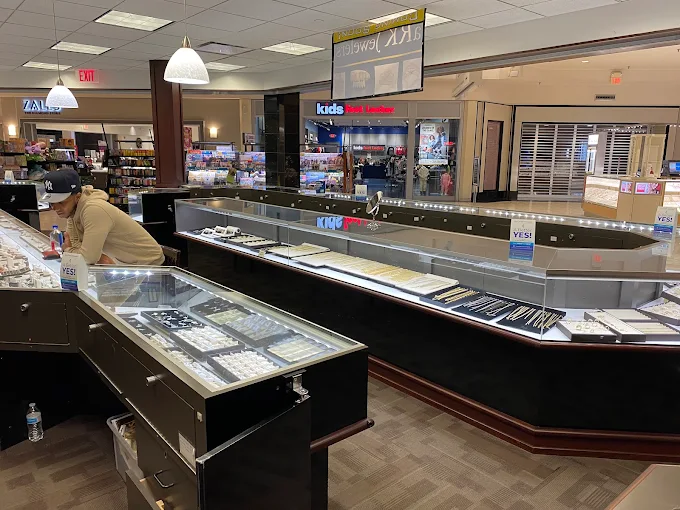 Inside aRK Jewelers, showing the jewelry display counters and seating